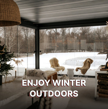Modern indoor space with large windows overlooking a snowy outdoor scene, featuring text 'Enjoy Winter Outdoors'.