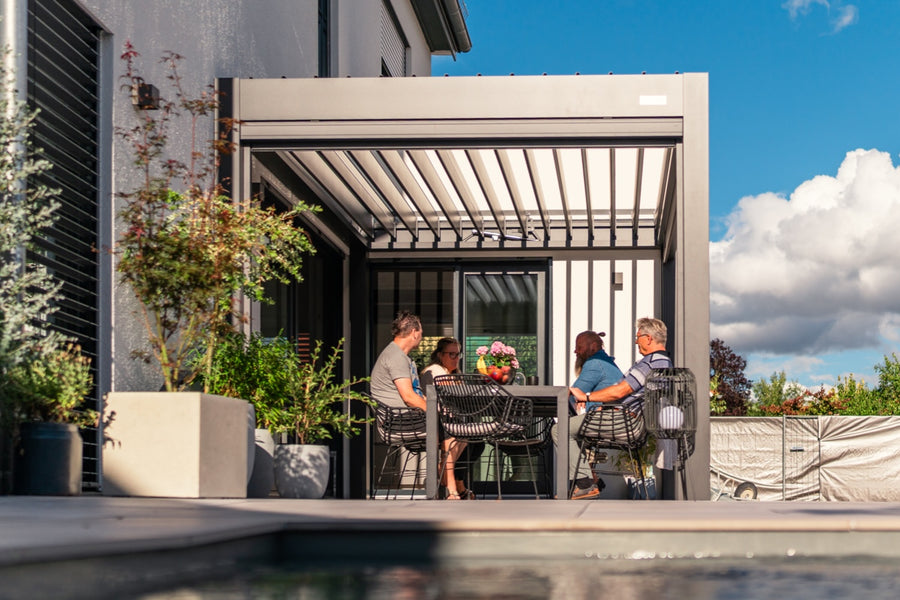 Completed PERGOLUX aluminium pergola beside a modern home