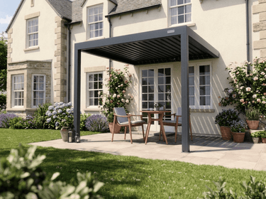 Patio with pergola, outdoor furniture, and flowers in a garden setting.