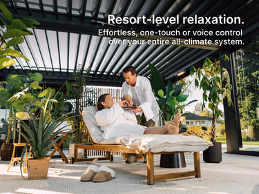 Person relaxing on a lounge chair under a pergola