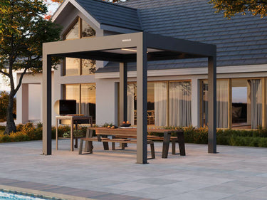 Patio with pergola, table, and chairs in front of a house