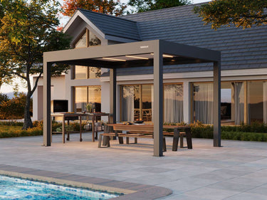 Outdoor pergola with seating area near a house and pool