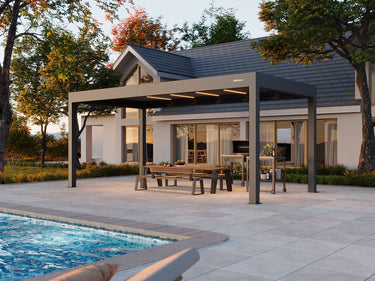 Patio with pergola, pool, and house in the background