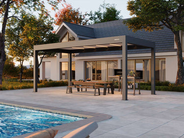 Patio with pergola, pool, and house in the background