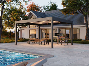 Outdoor patio area with pergola, pool, and house in the background