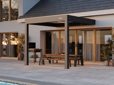 Outdoor patio area with pergola, furniture, and poolside view