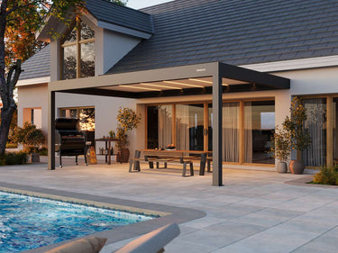 Patio with pergola, pool, and outdoor furniture in a residential setting