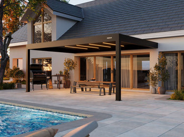 Patio with pergola, pool, and outdoor furniture in a residential setting