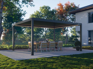 Outdoor patio with a pergola, table, and chairs in a garden setting.