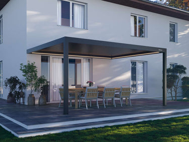 Pergola with outdoor dining table and chairs in front of a modern house.