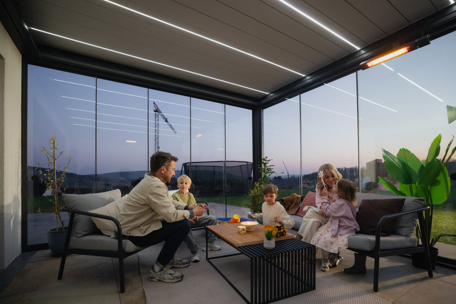 Family enjoying a premium PERGOLUX outdoor living space